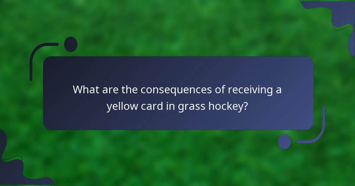 What are the consequences of receiving a yellow card in grass hockey?